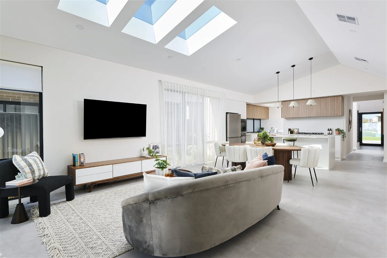 Avenue narrow lot display home by Plunkett. This design features an abundance of windows, high ceilings and skylights filling the entire space with natural light.
