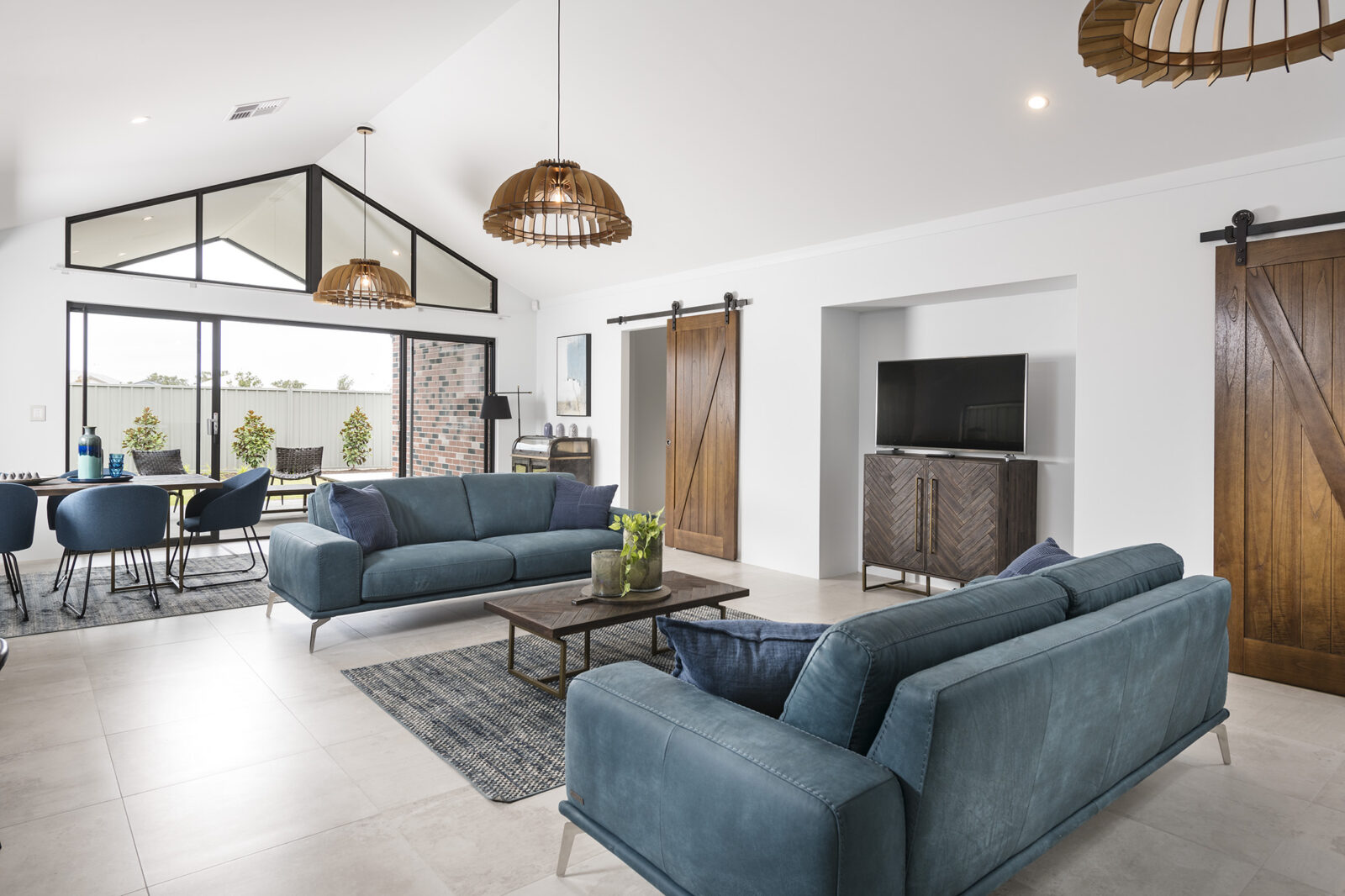 Living room of the Augusta Display, with rustic and modern elements by Plunkett Homes.